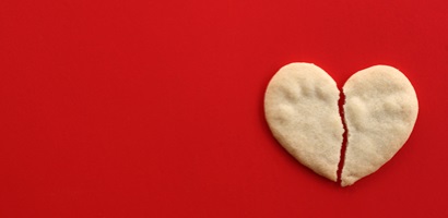 broken heart cookie on red concept breaking up 2023 11 27 04 56 57 utc