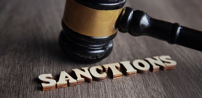 judge gavel and text sanctions on wooden table 2023 11 27 05 32 06 utc